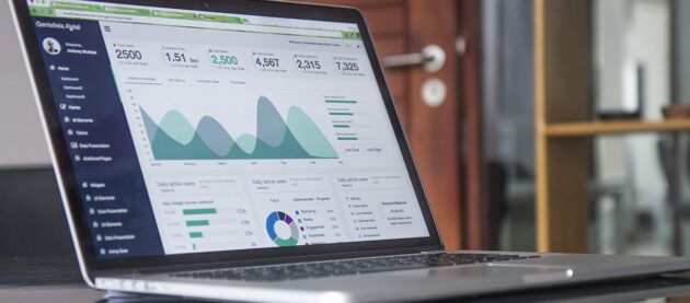 laptop with financial charts